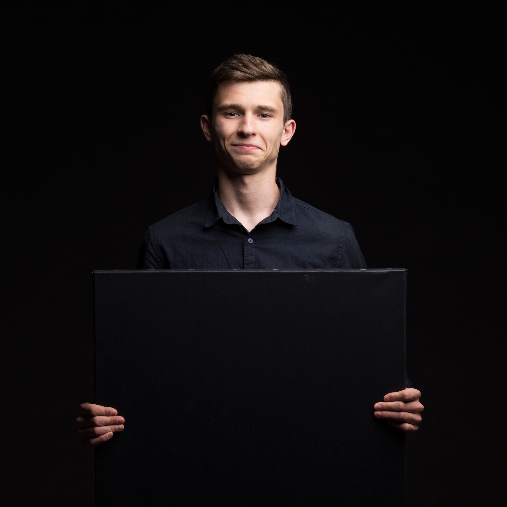 Young Happy Man Showing Presentation, Pointing on Placard over G